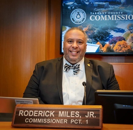 Commissioner Miles on Dais