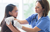 A nurse is giving immunization shot