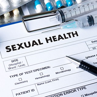 Sexual Health form, pen, syringe